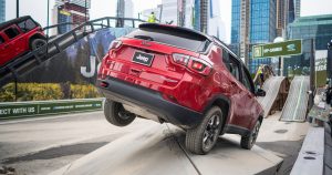 A Jeep Tailhawk on an urban display platform for an auto show in New York City.