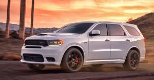 A white 2018 Dodge Durango SRT on a dessert road.