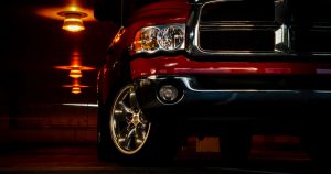 The front corner of a red Ram 1500.