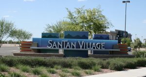 The entrance sign for the SaTan Village Shopping Center.