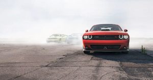 A red 2019 Dodge Challenger leaving others in the dust.